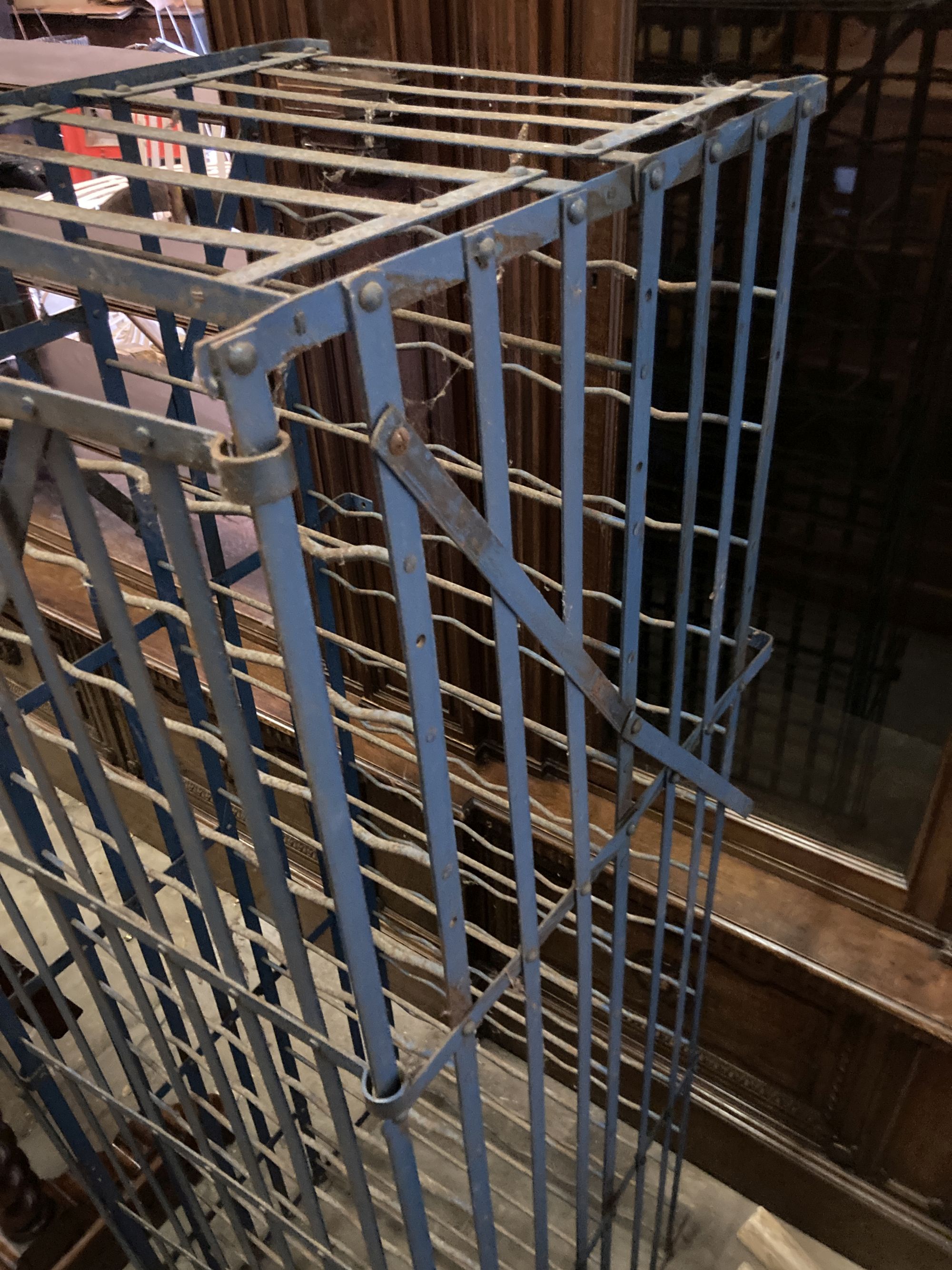 A French blue painted wrought iron wine rack cage, length 56cm, depth 58cm, height 166cm